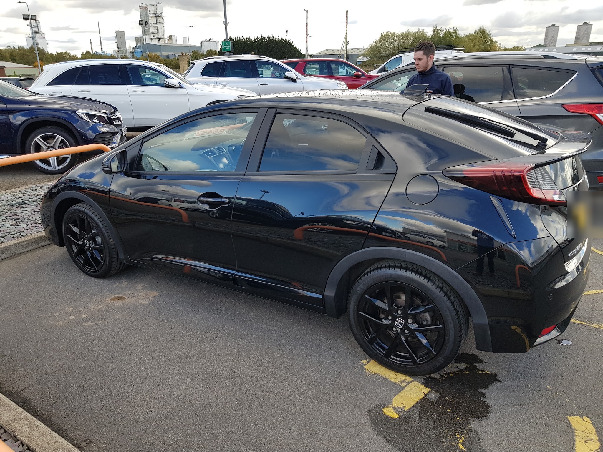 A customer's black Honda Civic in the car park on Island Carr Industrial Estate